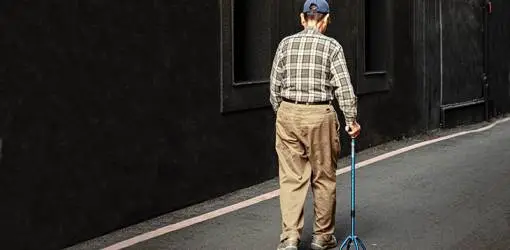 elderly man, older adult, senior, quad cane, four prong cane, balance issues, walking steadily, mobility equipment